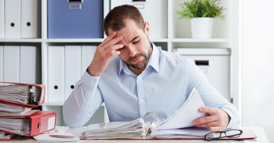 Man looking at paper work