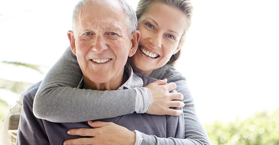 Elderly parents hugging