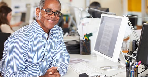 Smiling man at desk