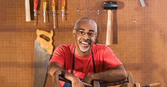 man-sitting-in-tool-shop