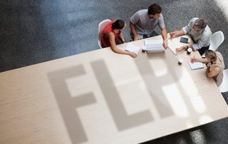 individuals discussing business at a table